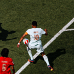 A player trying to dribble past othe players