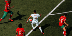 A player trying to dribble past othe players